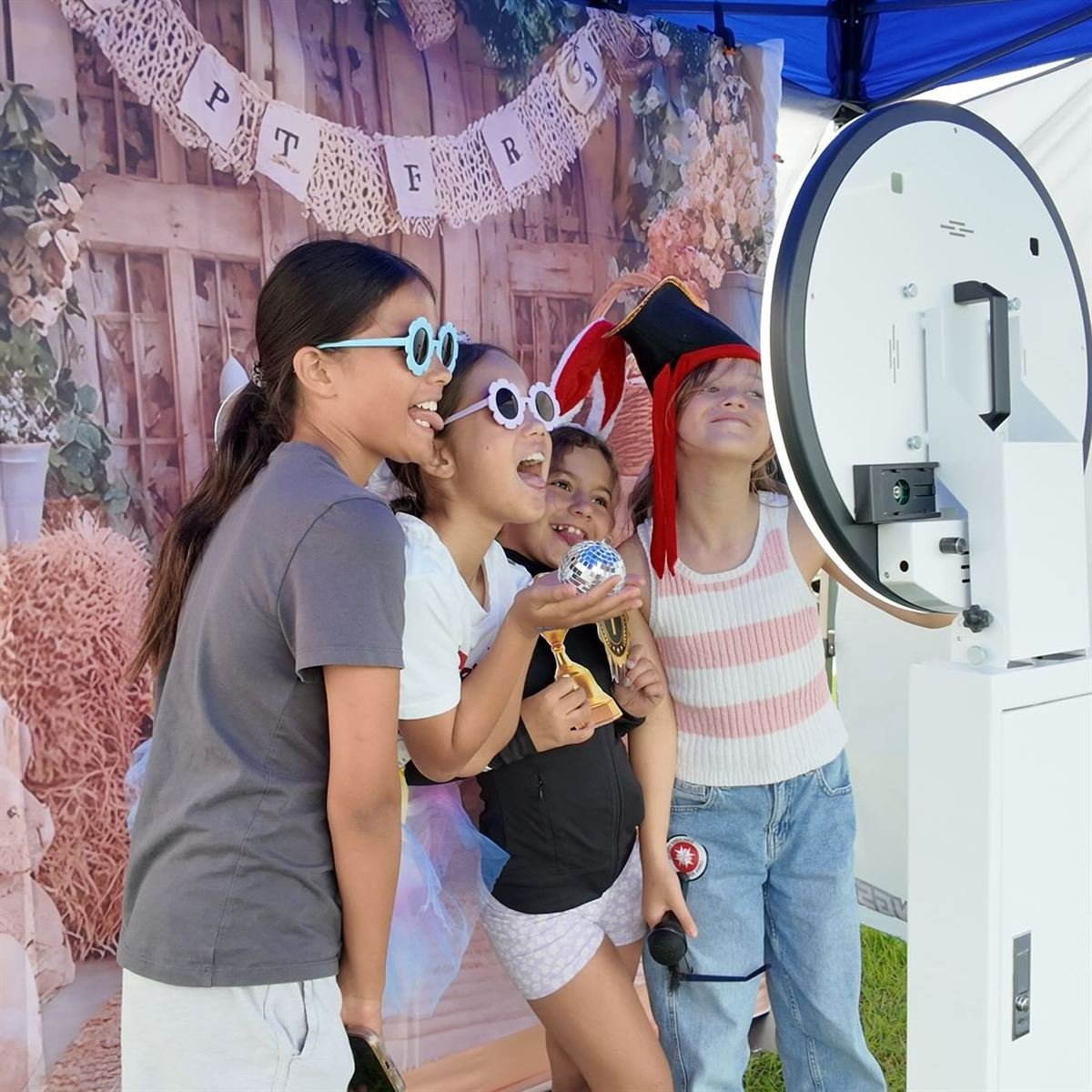 Guests taking a fun photo at a Perth booth