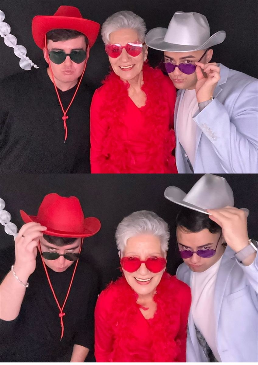Guests in cowboy hats and heart glasses at a Fotobooth Perth booth