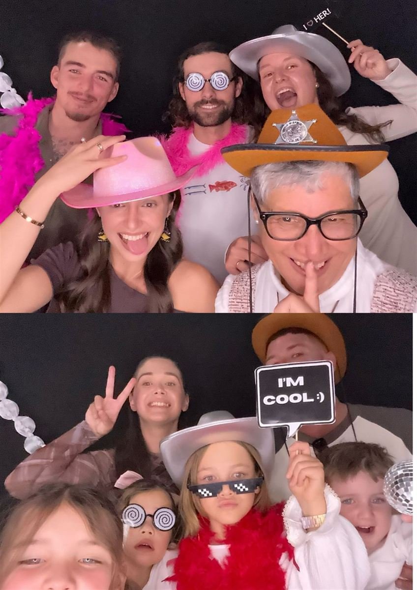 Group having fun with props at a Fotobooth Perth booth